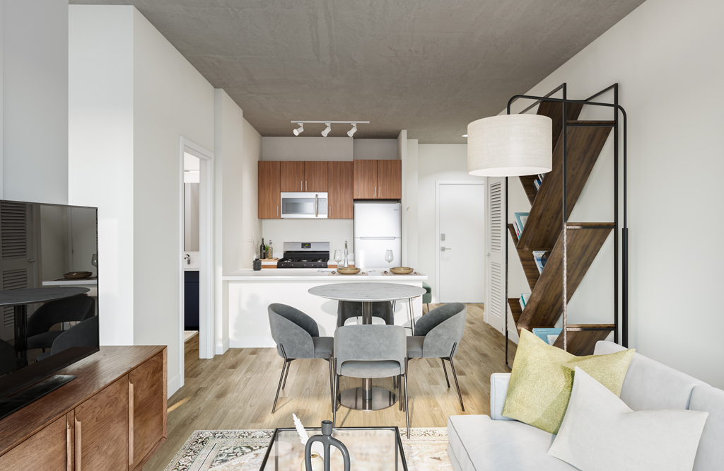 Modern open-concept living space with a kitchen, dining area, and living room. Light wood floors, white walls, gray and wood accents, and a geometric shelf add to the contemporary design.