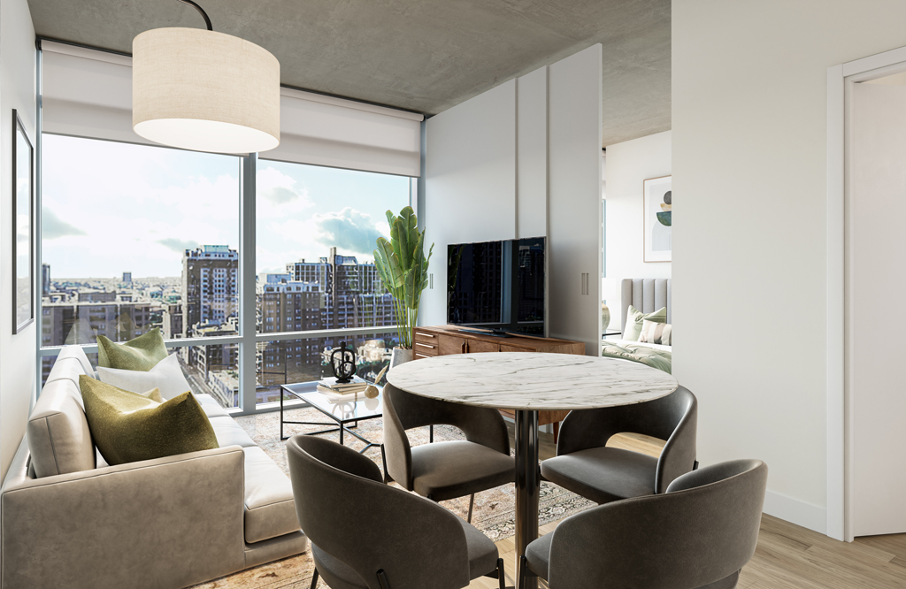 Modern apartment living room with a round table, four chairs, a sofa, TV, and large windows. A cityscape view is visible outside.