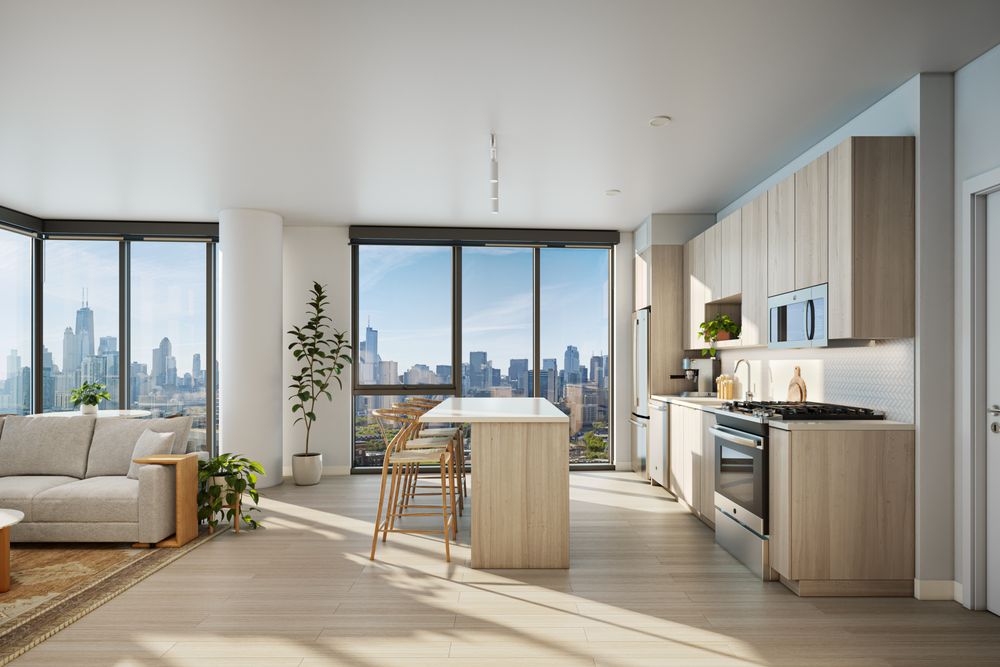 Modern kitchen and living area with light wood cabinets, island and stools, large windows, indoor plants, and city skyline view in the background.