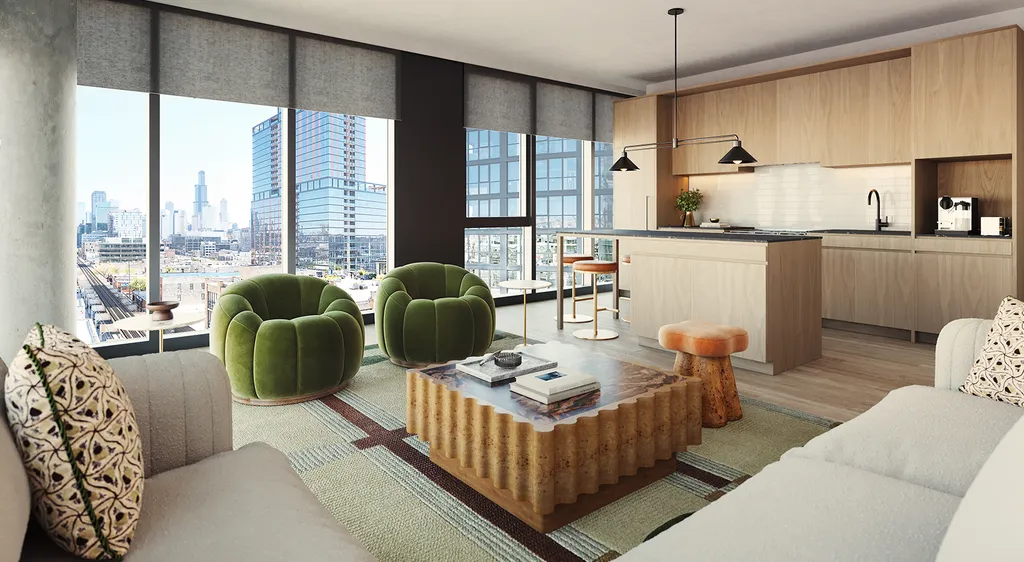 Modern apartment living room with large windows, city view, green chairs, beige sofa, wooden coffee table, and open kitchen with light wood cabinets and island.